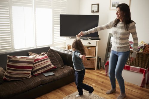 Daughter Dances With Mother At Home